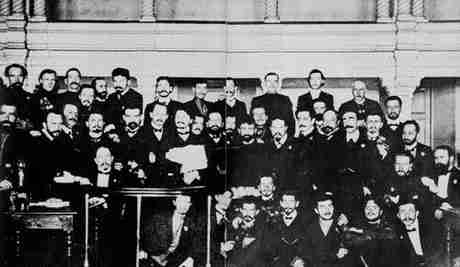 Trotsky (holding the brief case) among the members of the Petrograd Soviet, during their trial